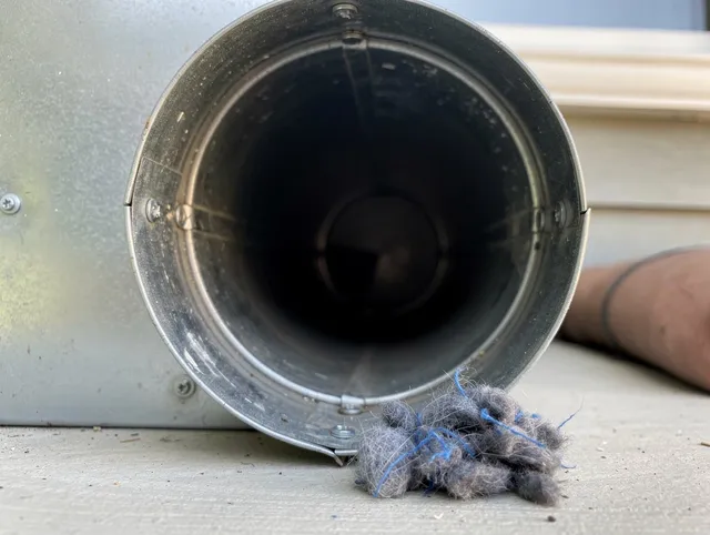 Sunrise Dryer Vent Cleaning technician using specialized equipment to clear severe dryer vent blockage in Sunrise